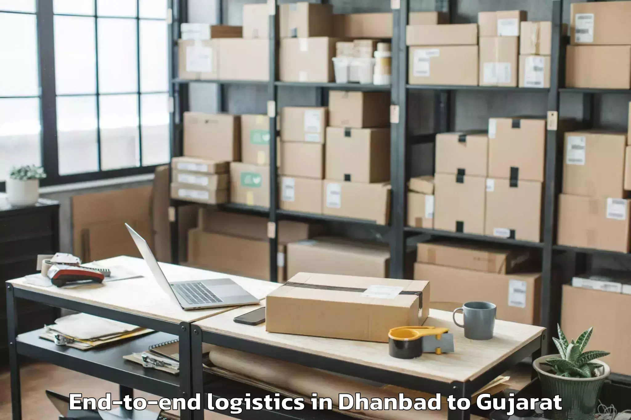 Trusted Dhanbad to Kaprada End To End Logistics